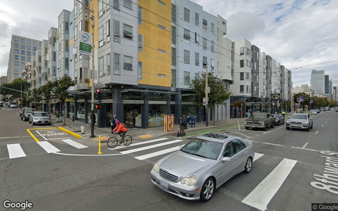 AI visualization of a proposed fix at 8th and Howard. Not a photograph.